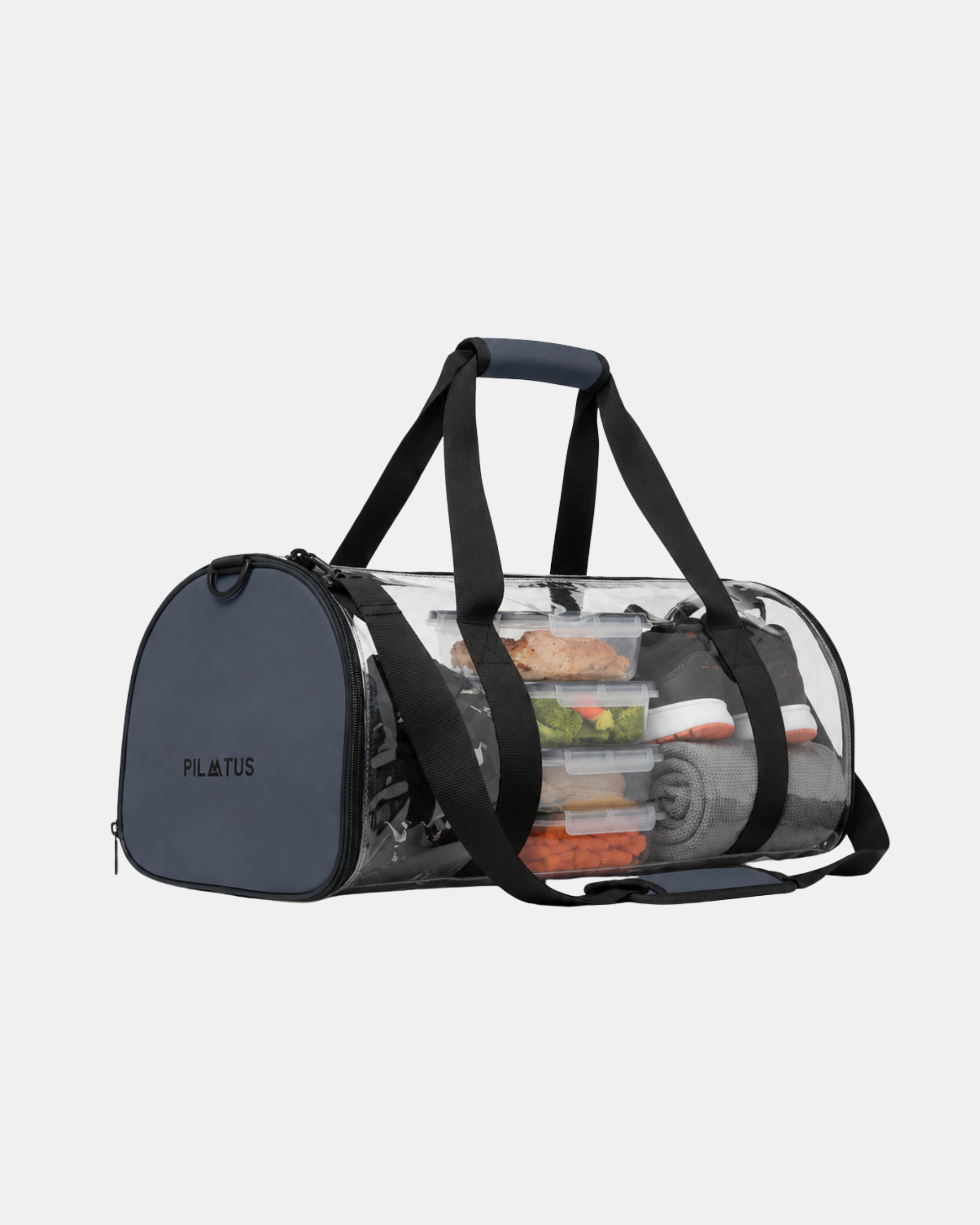 Bolsa deportiva transparente tipo duffel con asas acolchadas, mostrando tuppers con comida. Texto: PILATUS