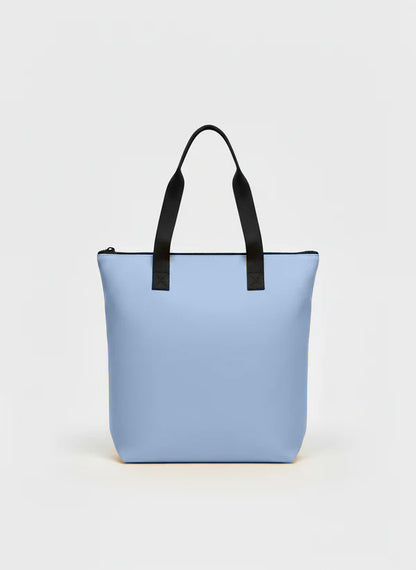 Parte trasera de la shopper bag d color azul cielo.